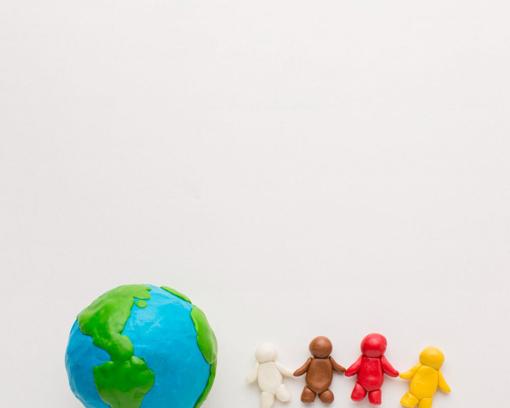 top-view-plasticine-globe-people-with-copy-space